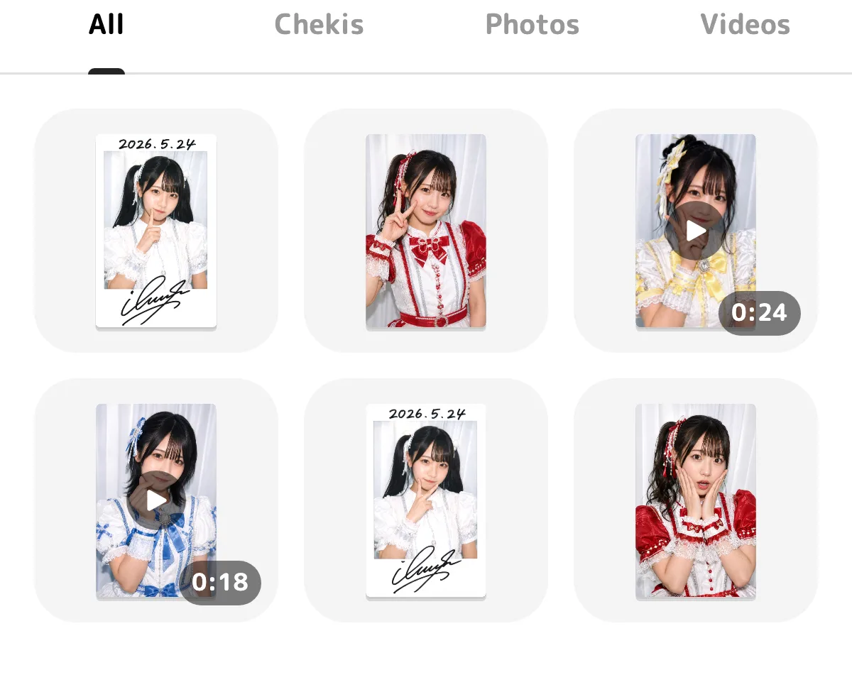 Cheki, photo, and video items together, with a play icon on the video